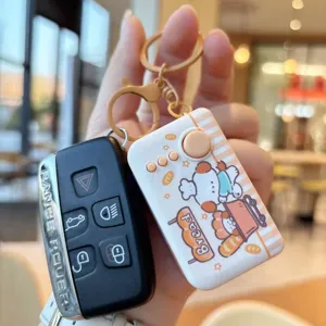 Car key case and cute cartoon decompression toy keychain with LED light, stylish design.
