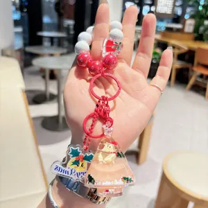 Cute Christmas tree quicksand keychain detail, acrylic beaded bag charm and key ring.