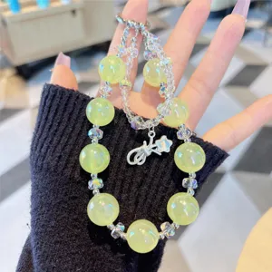 Crystal beaded phone charm and bag hanging chain with cute bow pendant for women.