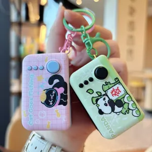 Close-up detail of cute cat and panda decompression fidget keychains with glowing lights.