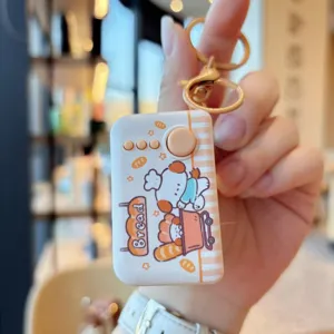 Detailed close-up of a cute cartoon decompression keychain with led light, durable metal hook.