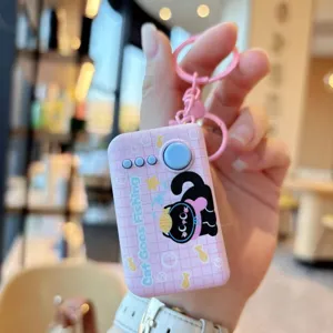 Cute pink decompression toy keychain with cat pattern and LED light, perfect for cute bag pendant.