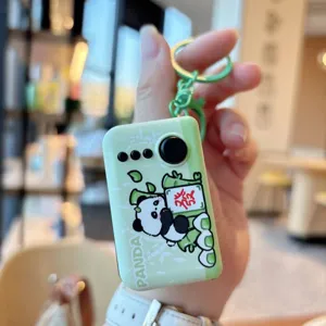 Cute panda mahjong glowing keychain detail view, portable decompression toy backpack pendant.
