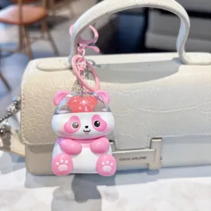 Cute glowing sound panda keychain detail shot, pink heart cute bag pendant accessory.
