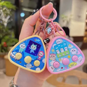 Close up detail shot of cute electronic pet keychain toy, colorful cartoon pendant.