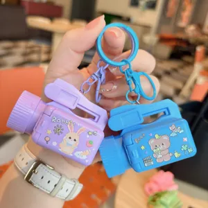 Cute cartoon camera projector keychain with adorable rabbit and bear designs for kids and students.