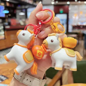 Cute cartoon horse keychain detail shot, creative bag pendant with lucky pouch and persimmon.