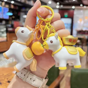 Cute horse keychain charm with lucky ingot and orange pendant for bag decoration detail view