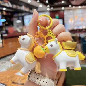 Cute pony keychain with gold ingot and persimmon charms, creative bag pendant accessory.