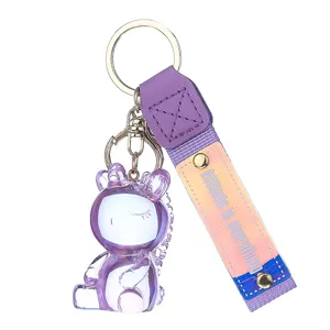 Colorful translucent resin unicorn keychain with purple strap, cute bag charm and car key ring.