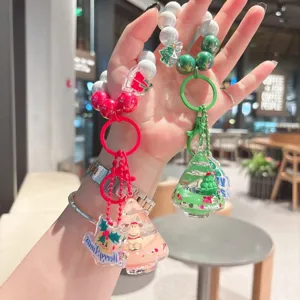 Cute Christmas tree liquid sand keychain with beaded strap, perfect bag charm and gift.