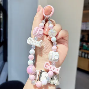 Pastel beaded phone charm keychain with cute camera and letter pendants for bags.