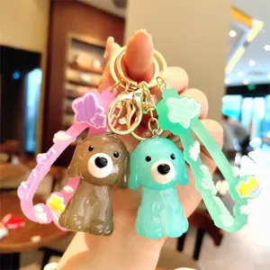 Adorable porte-clés chiot en gelée acrylique avec sangle en silicone et anneaux dorés.
