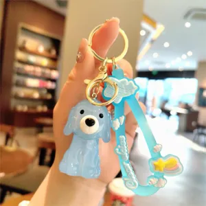 Mignon porte-clés chien gelée en acrylique bleu avec lanière et anneau en métal doré.
