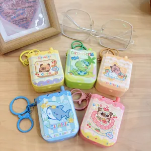 Cute cartoon capybara game console keychain and bag pendant, colorful portable toy accessory detail.