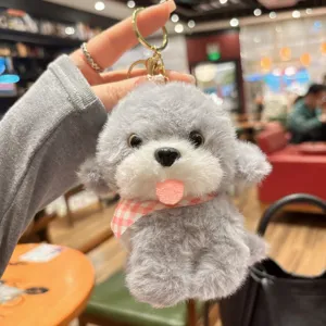 Close up view of grey fluffy poodle puppy plush keychain with cute checkered scarf