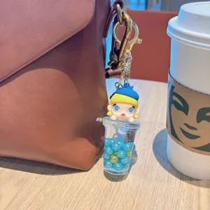 Simpatico portachiavi tazza tè al latte con sabbie mobili, ciondolo bambola per borsa con clip.