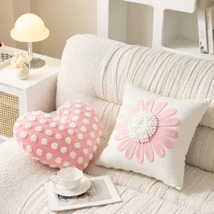 Cozy pink heart pillow and white 3d daisy cushion detail for warm aesthetic room decor.