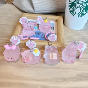 Simpatico portachiavi maialino rosa luminoso in resina, adorabile ciondolo zaino e regalo.