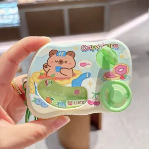 Mini cute cartoon capybara racing game console toy keychain for student school bags.