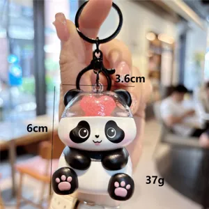 Cute cartoon panda keychain with transparent heart design, portable bag pendant and charm.