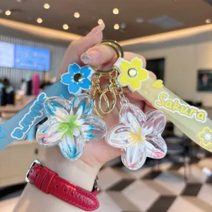 Detailed view of the cute liquid floating flower keychain with vibrant colorful straps and charms.