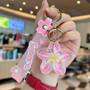 Creative liquid floating plumeria flower keychain bag charm aesthetic cute accessory gift details.