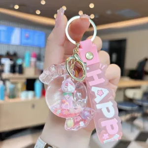 Cute acrylic quicksand candy keychain with oil-filled doll, perfect bag charm for girls.