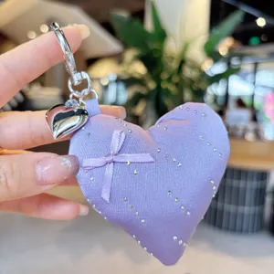 Purple heart keychain bag charm with bow and rhinestones, cute pendant for phone and keys.