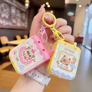 Cute capybara cartoon game console keychain mini pendant toy, detailed close-up display.