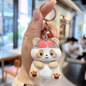 Cute cartoon panda keychain with clear dome and love heart pendant for bags and car keys.