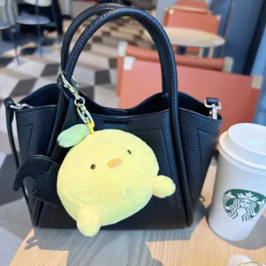 Cute yellow plush bird keychain bag charm, soft stuffed animal pendant for purses and backpacks.