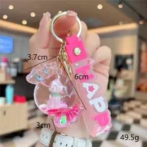 Cute acrylic quicksand candy keychain with doll charm and pink strap for school bag backpack.