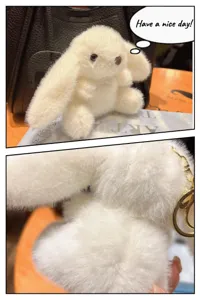 Detail view of the fluffy white bunny plush keychain, showing soft faux fur and gold clasp.