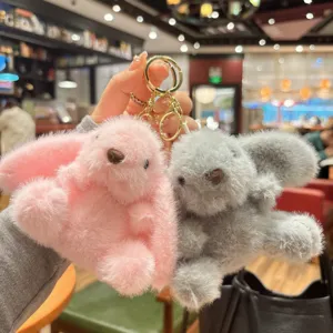 Fluffy bunny keychain plush toy detail, cute long-eared animal doll pendant for bags and keys.