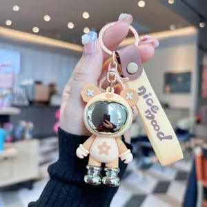 Lindo llavero de astronauta de dibujos animados de PVC con correa para mochila escolar.