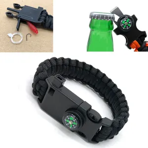 Multifunctional outdoor survival paracord bracelet with compass whistle and fishing gear.