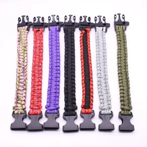 Multi-color woven paracord survival bracelet with plastic buckle, durable outdoor gear.