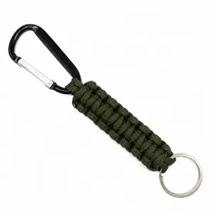 Close-up detail view of army green paracord keychain with black metal carabiner and ring.
