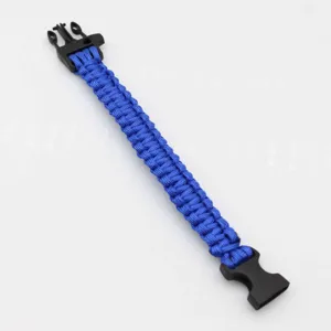 Close-up detail of the durable blue paracord survival bracelet featuring a sturdy black buckle.