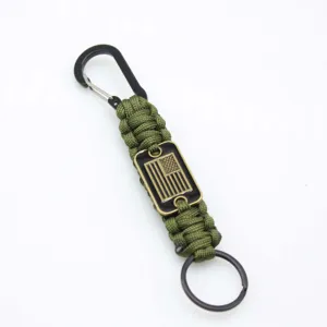 Handmade tactical paracord keychain with carabiner and military flag badge for outdoor use.
