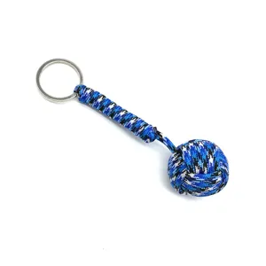 Paracord keychain detail showing blue camo woven monkey fist ball and sturdy metal ring.