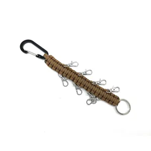 Detailed view of the brown paracord keychain with multiple lobster clasps and carabiner.