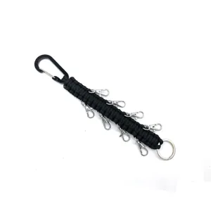 Multifunctional black paracord keychain with carabiner and multiple clasps, durable outdoor gear.