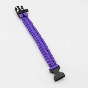 Purple paracord survival bracelet detail shot, durable nylon rope with sturdy plastic buckle.