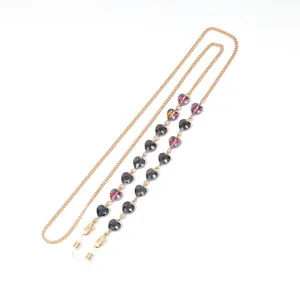 Gold-toned metal glasses chain featuring faceted heart-shaped crystal beads for women.