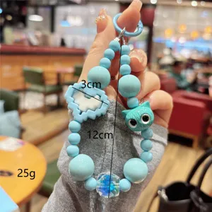 Blue beaded keychain with cute cat charm and heart pendant, stylish DIY accessory for keys or bags.