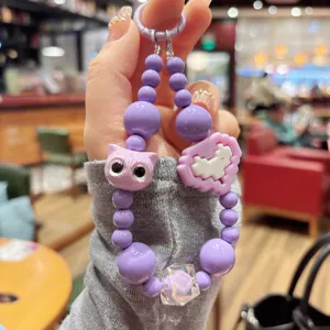 Purple beaded keychain with cute cat charm, DIY candy style pendant for keys and bags.