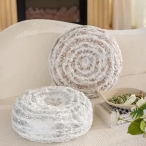 Round plush throw pillow with tree ring texture, cozy decorative cushion for sofa and bed.