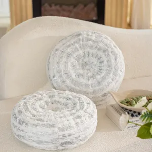 Detailed close-up shot of textured round tree ring throw pillow, fluffy decorative sofa cushion.